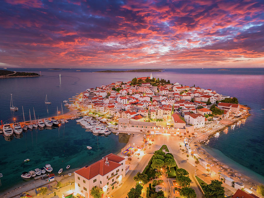 Croatia, Dalmatia, Primosten, Mediterranean Sea, Adriatic Coast, Aerial View Of Peninsula On Which The Old Town Of Primosten Stands, Blue Hour Before Sunrise With Colored Clouds Digital Art by Manfred Bortoli