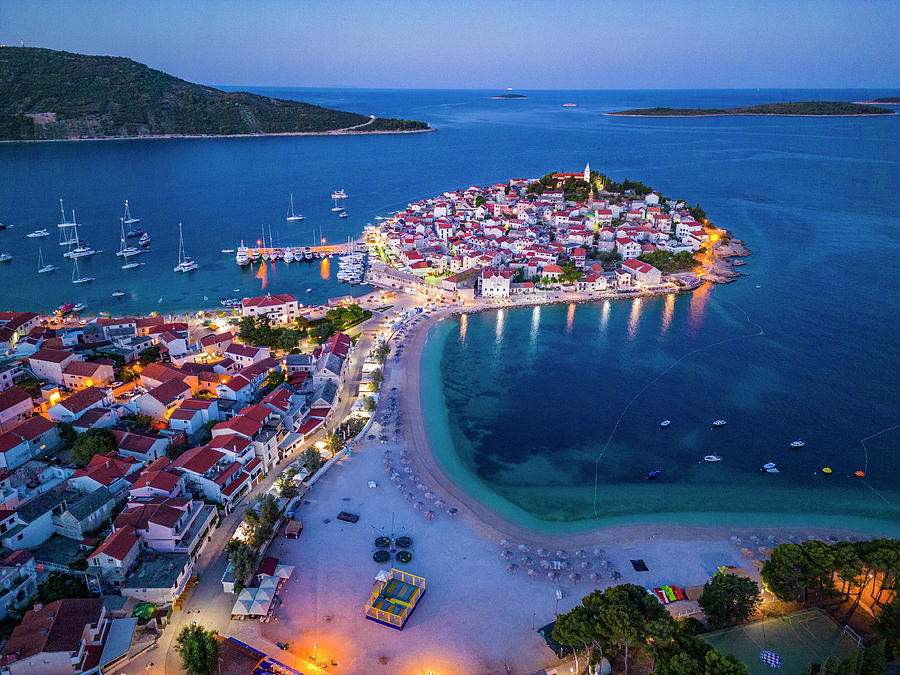 Croatia, Dalmatia, Primosten, Mediterranean Sea, Aerial View Of The Peninsula On Which The Old Town Of Primosten Stands And The Beaches At The Blue Hour Before Sunrise Digital Art by Manfred Bortoli