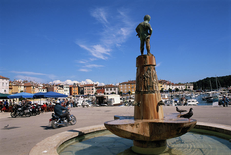 Croatia, Rovinj, Fountain In Harbour Photograph by Connie Coleman
