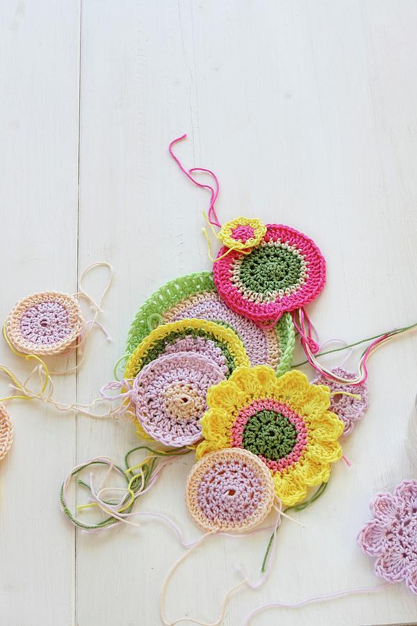Crocheted Coasters Of Various Colours On White Surface Photograph by Regina Hippel