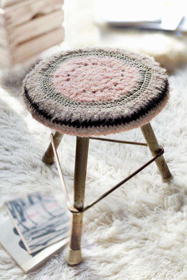 Crocheted Seat Cushion On Three-legged Stool On Flokati Rug Photograph by Sabine Lscher