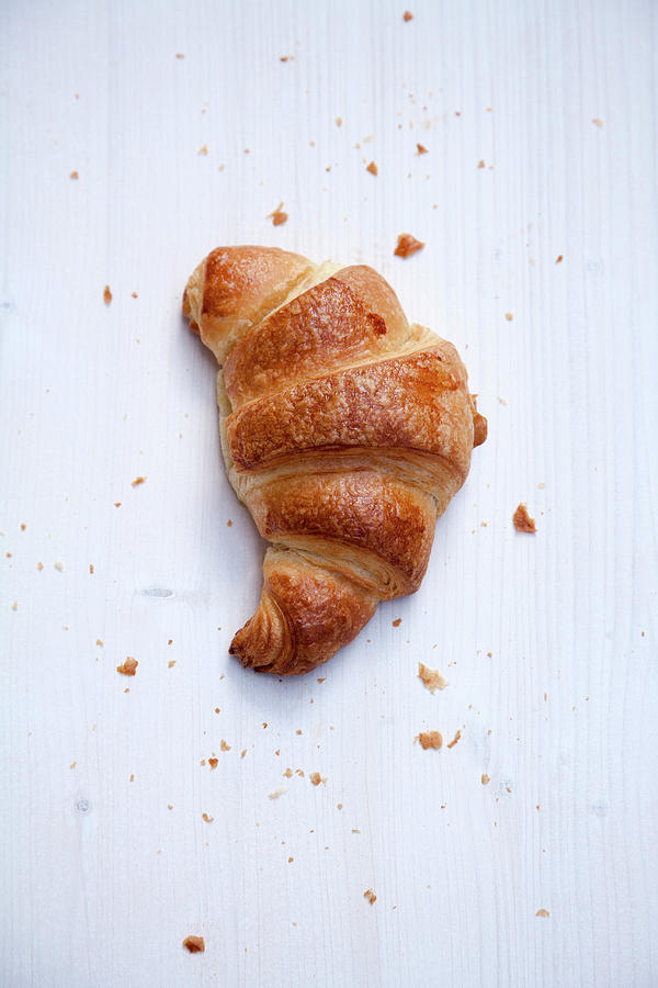 Croissant On White Cloth Photograph by Michael Wissing