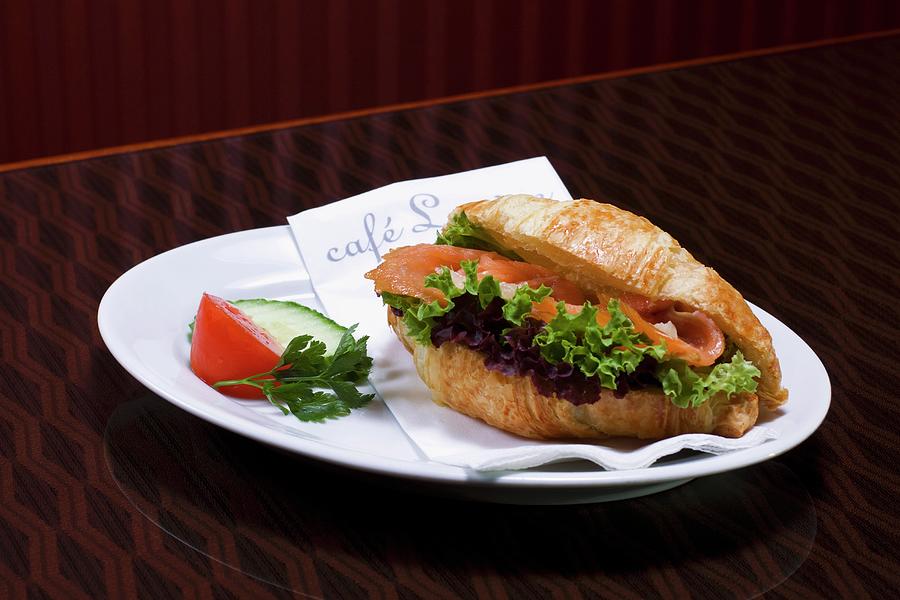 Croissant With Salmon And Salad Photograph by Jan Prerovsky