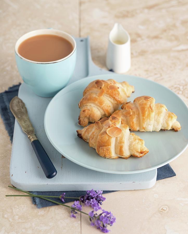 Croissants With Almond Flakes, Served With Tea Photograph by Komar