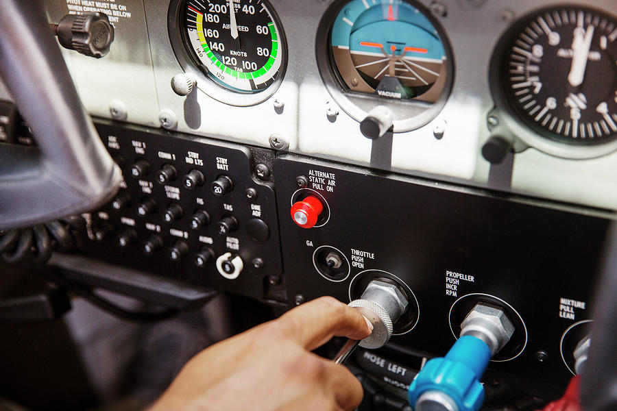 Cropped Image Of Pilot Operating Control Panel In Airplane Photograph ...