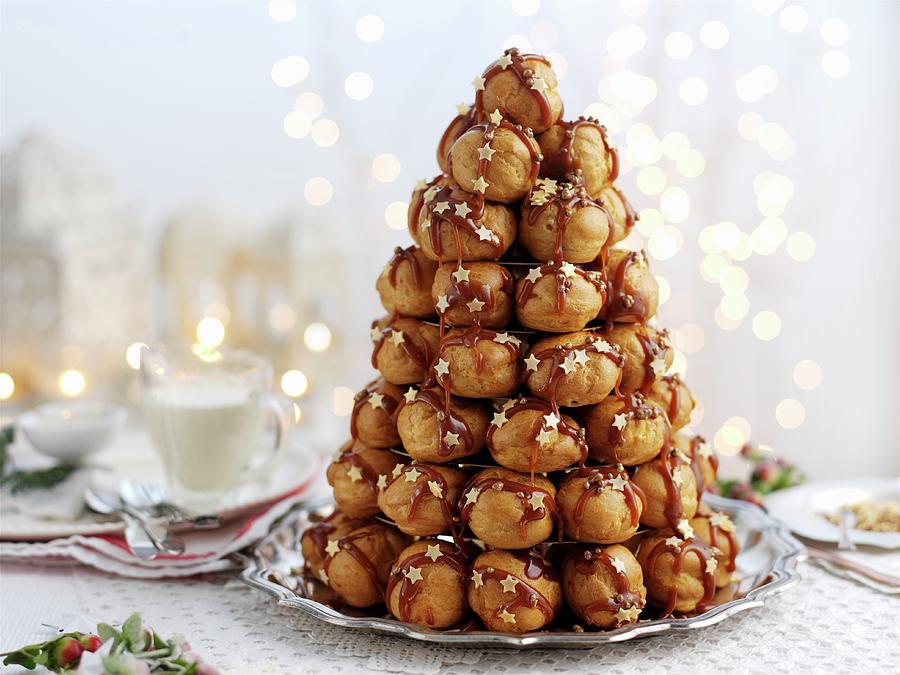 Croquembouche With Caramel Sauce For Christmas Photograph by Ian Garlick