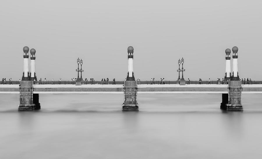 Crossing The Bridge Photograph by Ritxard Perez