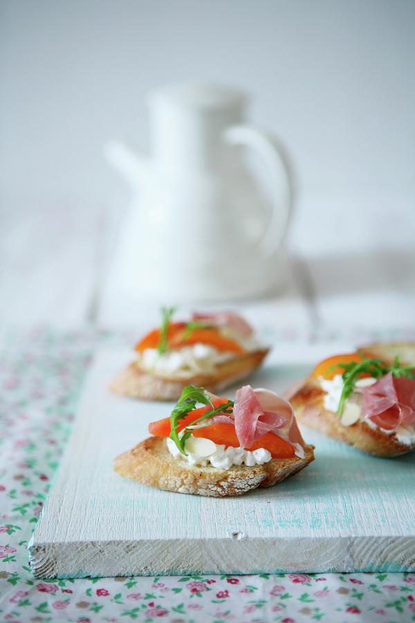 Crostini Topped With Cream Cheese, Apricots And Ham Photograph by Viola Cajo