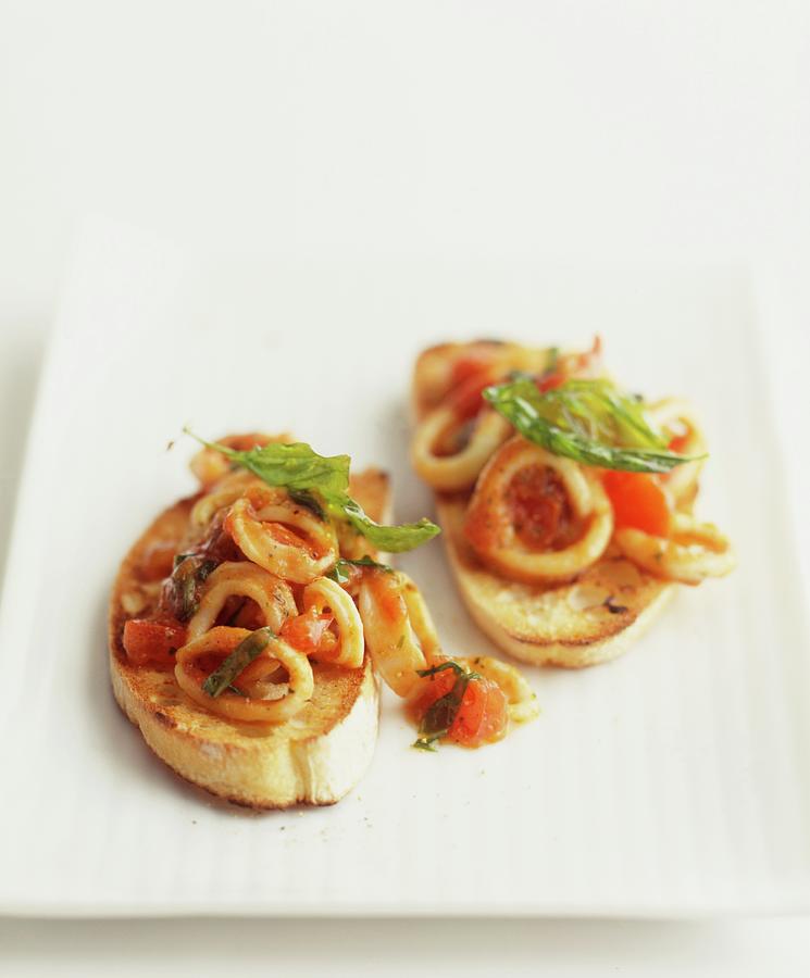 Crostini With Calamari And Tomatoes Photograph by Michael Wissing