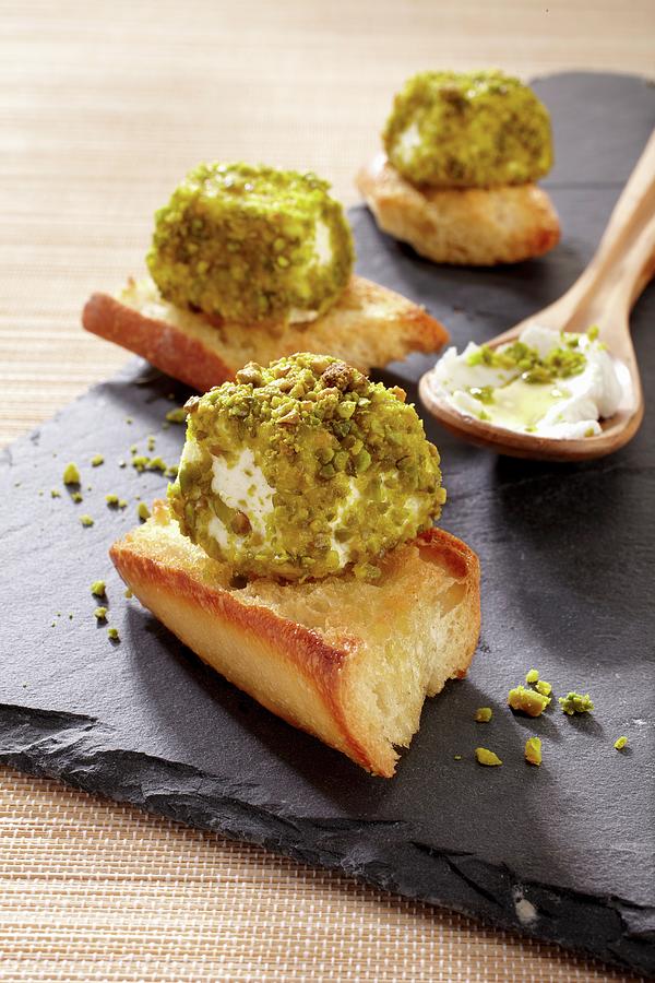 Crostini With Pistachio-coated Goats Cheese Photograph by Alessandra Pizzi