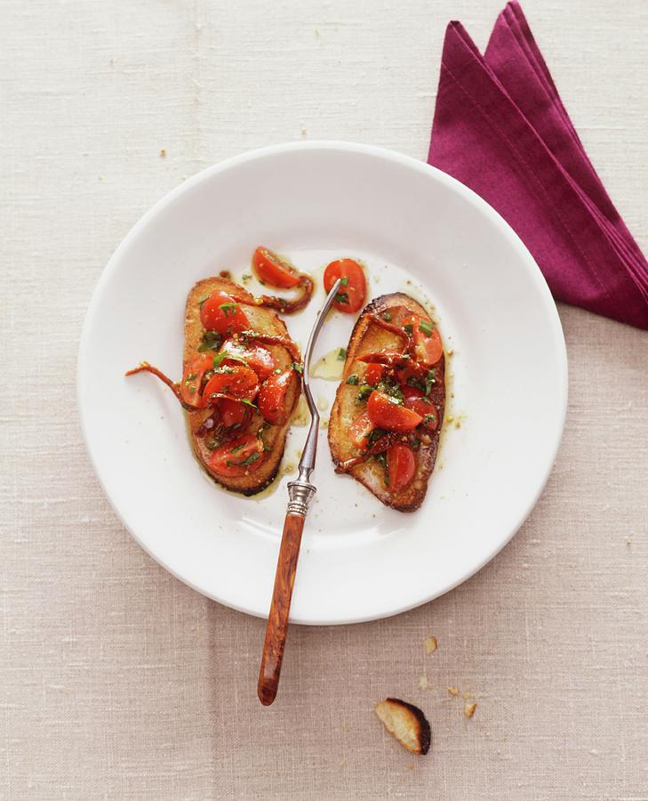 Crostini With Tomatoes And Anchovy Fillets Photograph by Michael Wissing