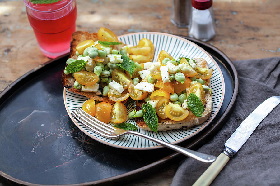 Crostini With Yellow Tomatoes, Peas, Mint And Feta Cheese Photograph by Lara Jane Thorpe