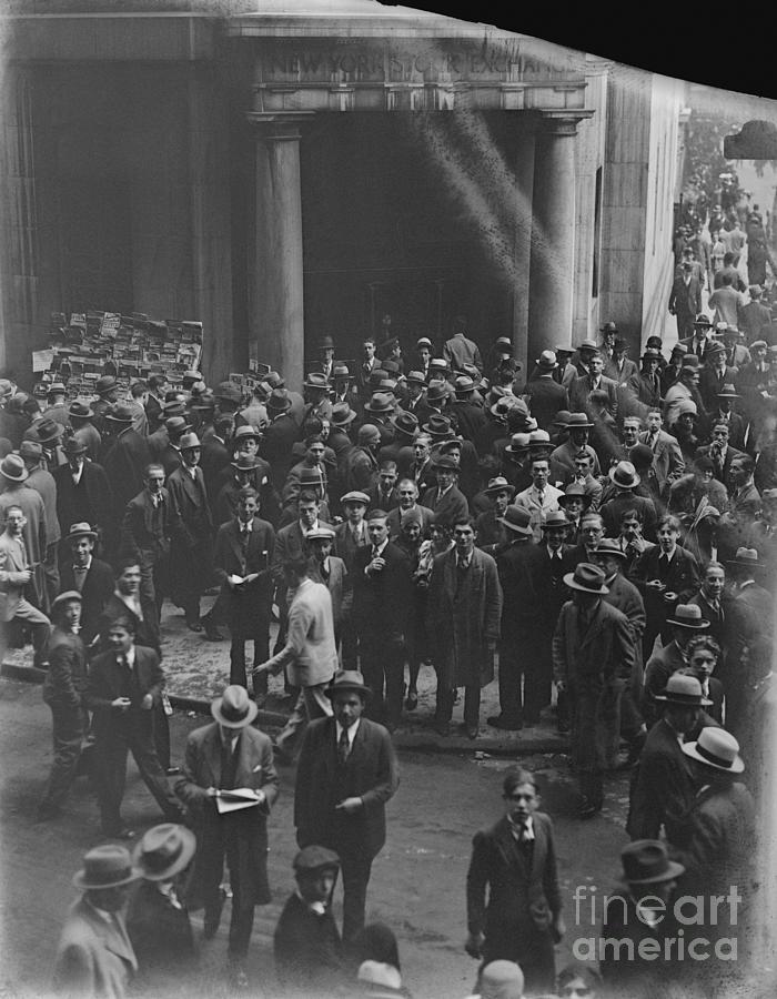 Crowd Of People Reading Newspaper Photograph by Bettmann