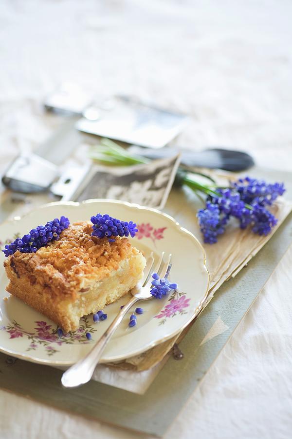 Crumb Cake Decorated With Grape Hyacinths Photograph by Alicja Koll