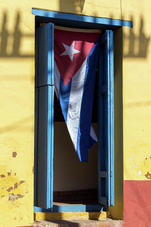 Cuban Flag In Open Doorway In Trinidad Photograph by Anne08