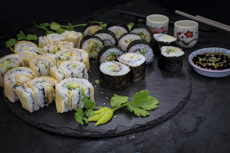 Cucumber And Avocado Sushi Rolled In Seaweed And Yuba Skins Photograph by Adelina