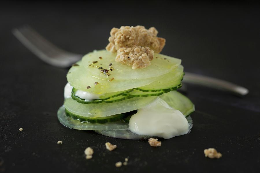 Cucumber And Celery Salad With Soya Yoghurt And Almond Crispies Photograph by Jan Wischnewski