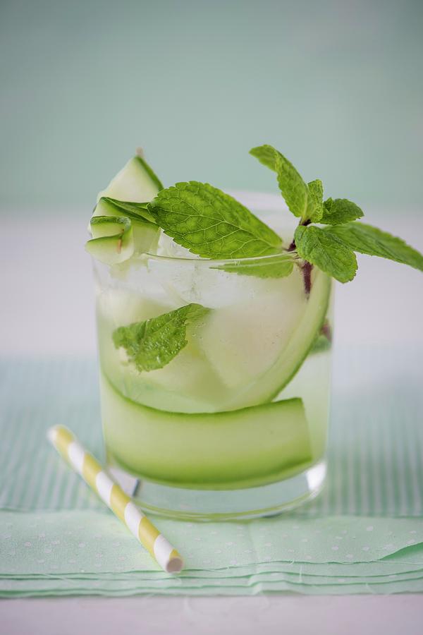 Cucumber And Melon Water With Fresh Mint In A Glass, Close Up. Photograph by Magdalena Hendey