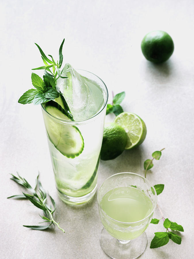 Cucumber Cocktails With Lime And Herbs Photograph by Valerie Janssen