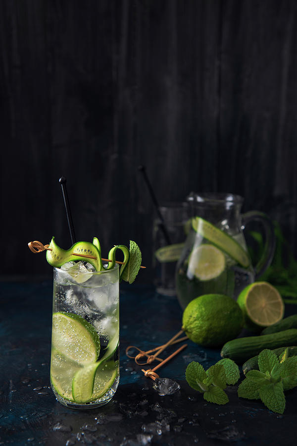 Cucumber, Lime And Mint Sparkling Water On Ice Photograph by Magdalena Hendey