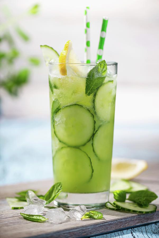 Cucumber Spritzer With Mint Leaves Photograph by Komar - Fine Art America