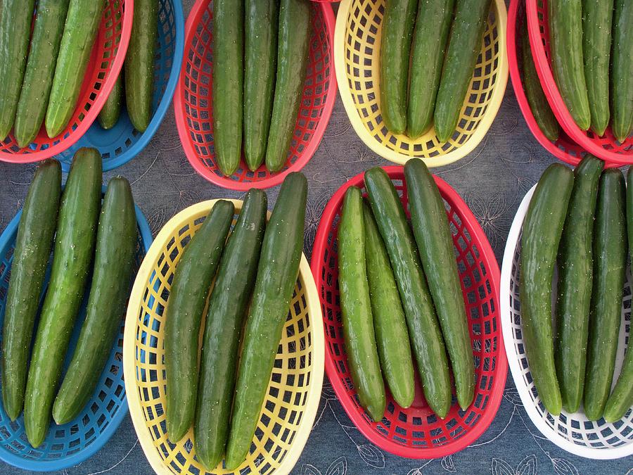 Cucumbers In Plastic Baskets Photograph by William Boch