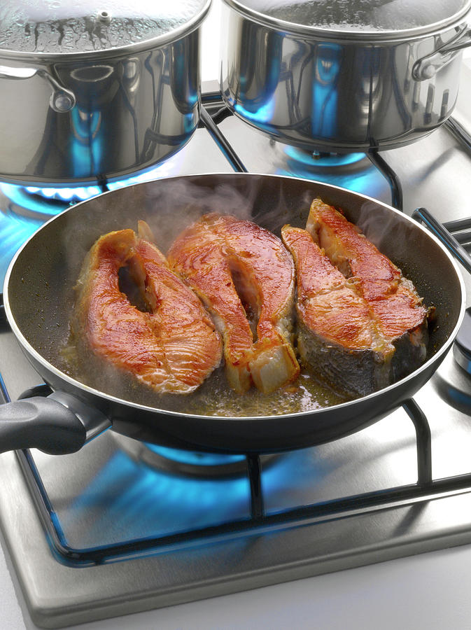 Salmon Photograph - Cuisson De Darnes De Saumon a La Poele Cooking Salmon Steaks In A Frying Pan by Studio - Photocuisine