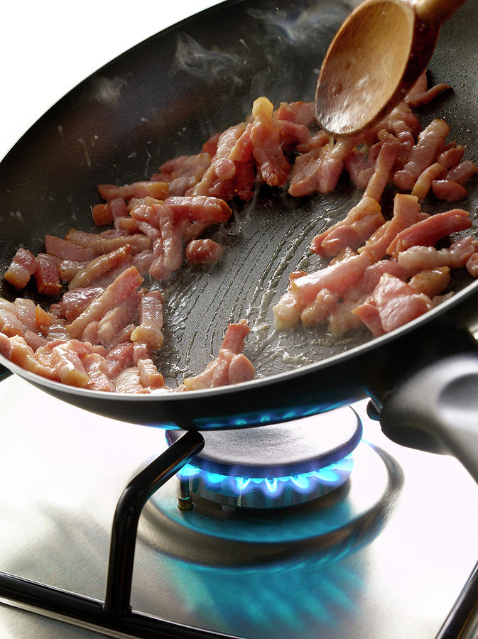 Cuisson De Lardons a La Poele Cooking Diced Bacon In A Frying Pan Photograph by Studio