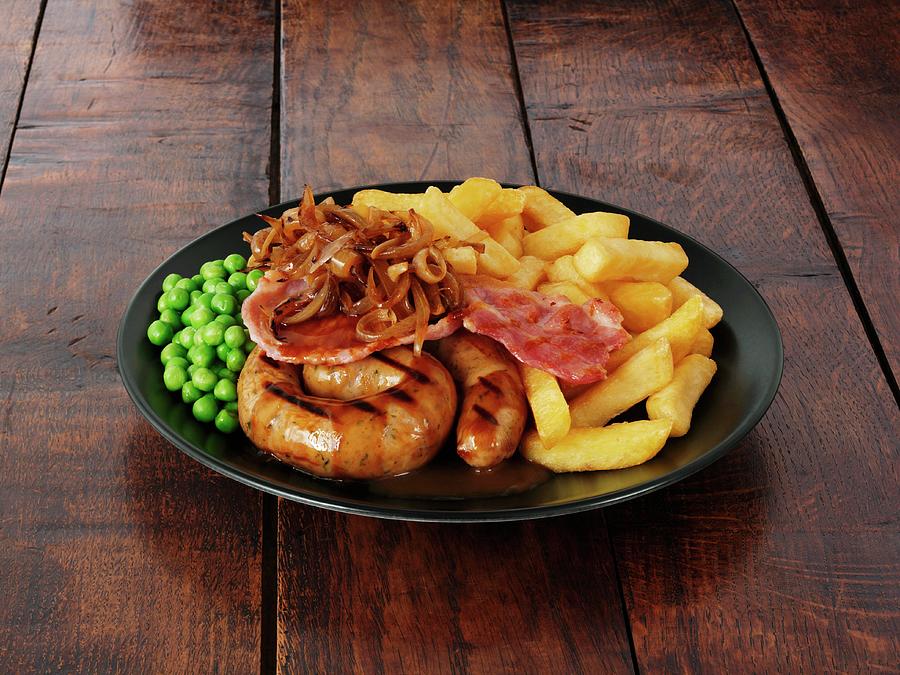 Cumberland Sausage With Bacon, Onions, Gravy And Chips Photograph by Frank Adam