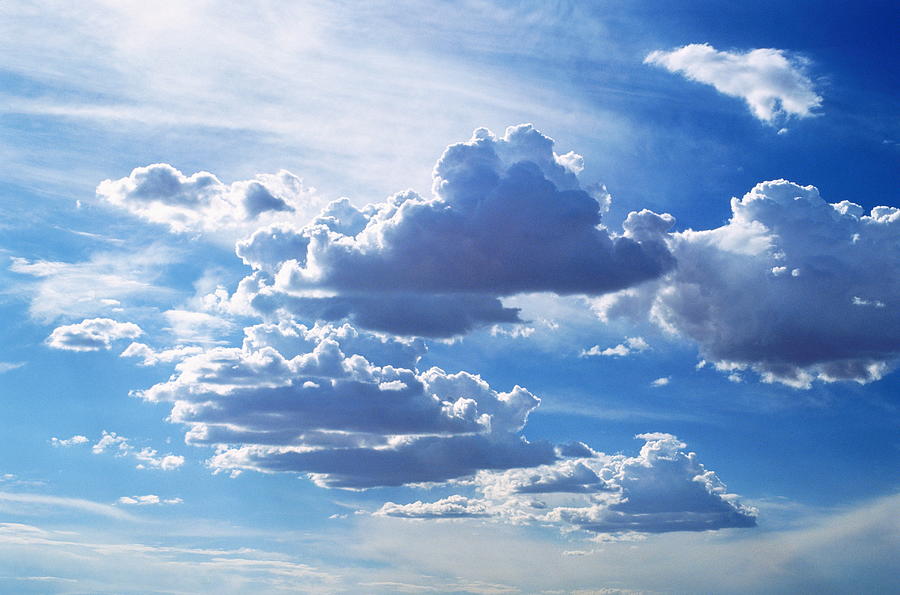 Cumulus And Higher Cirrus Clouds Photograph by Ray Massey