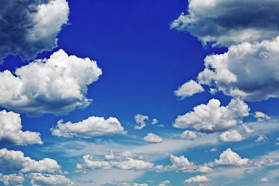 Cumulus Clouds And Blue Sky Photograph by John W Banagan