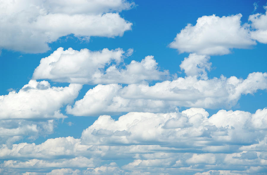 Cumulus Clouds In A Clear Blue Sky Photograph by Laurance B. Aiuppy