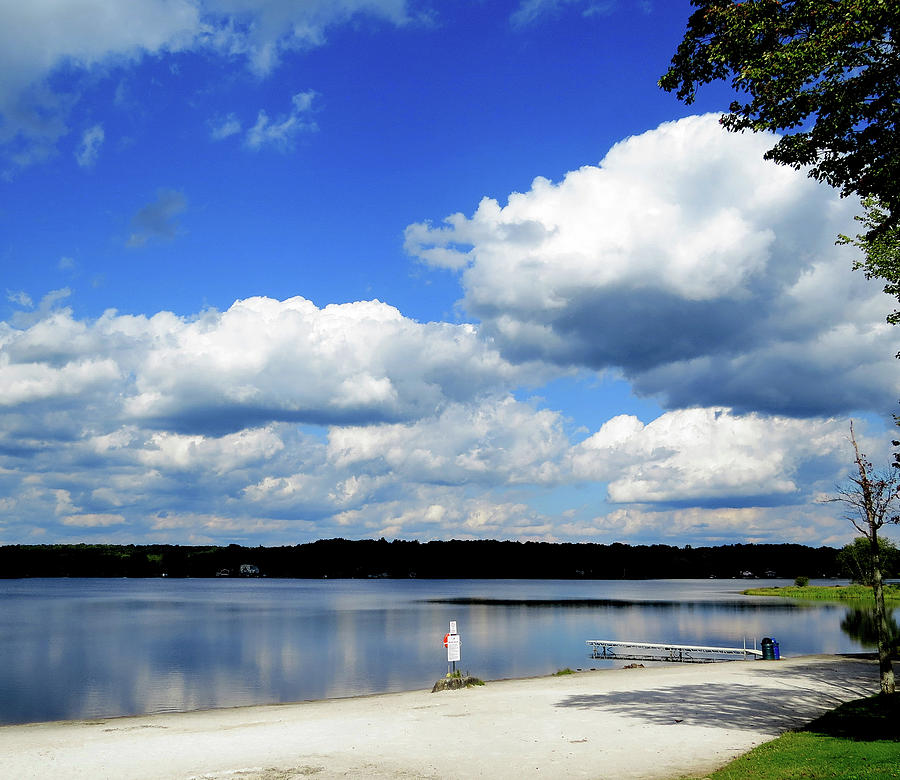 Cumulus Clouds Over a Lake in the Pocono Mountains in Pennsylvania Photograph by Linda Stern