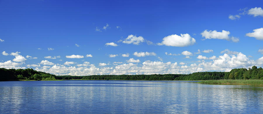 Cumulus Clouds Over Lake Photograph by Avtg