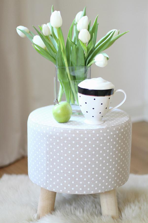 Cup Of Cappuccino And Vase Of White Tulips On Grey Polka-dot Stool Photograph by Sylvia E.k Photography