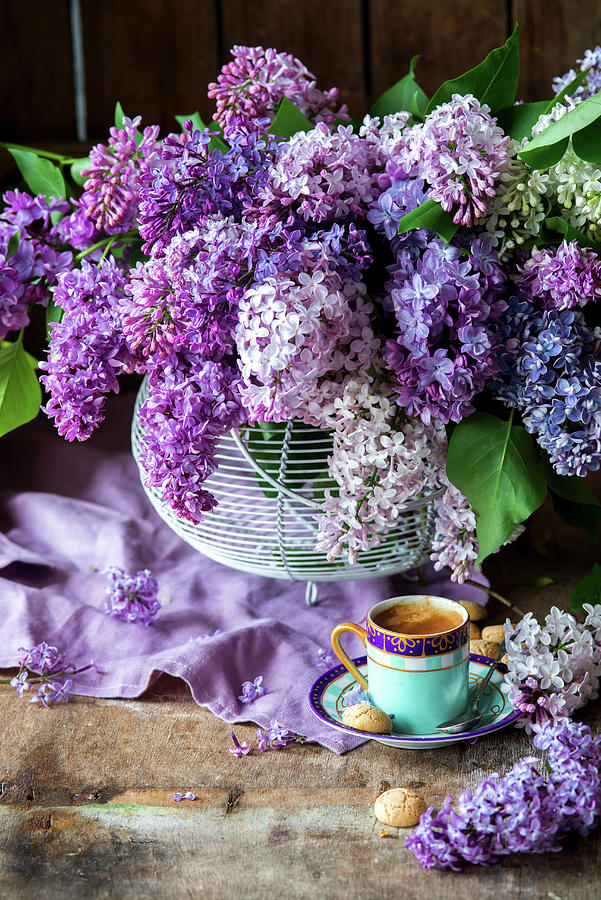 Cup Of Coffee In Front Of Bouquet Of Purple Lilac Photograph by Irina Meliukh