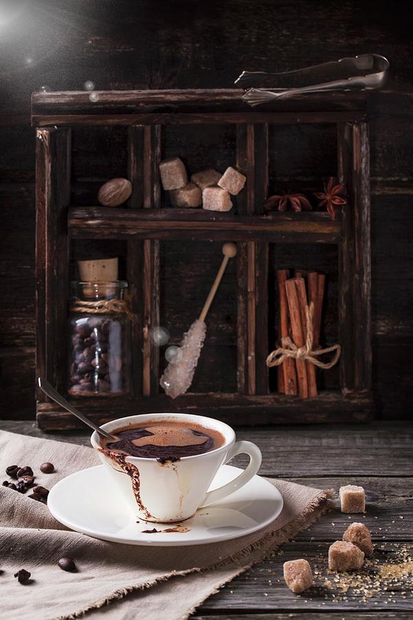 Coffee Photograph - Cup Of Coffee Served On Old Wooden Table With Sugar And Spices by Natasha Breen