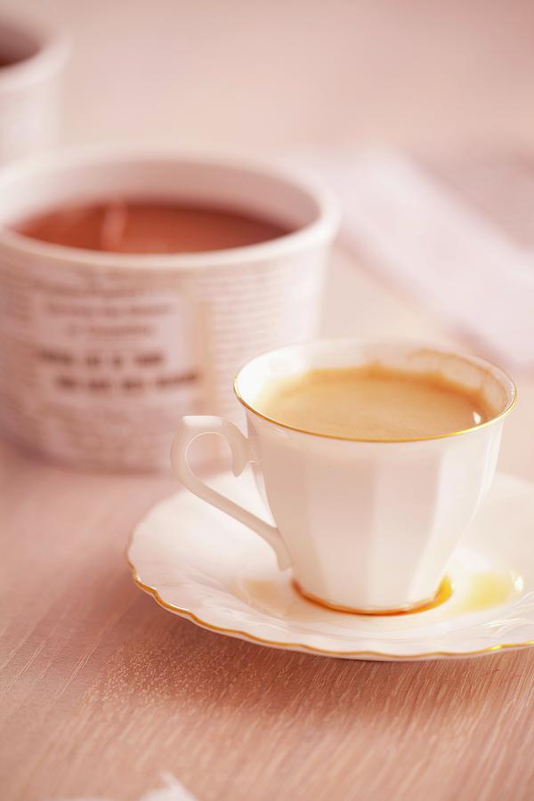 Cup Of Espresso Coffee; Chocolate Mousse In A Paper Cup Behind Photograph by Studio Lipov