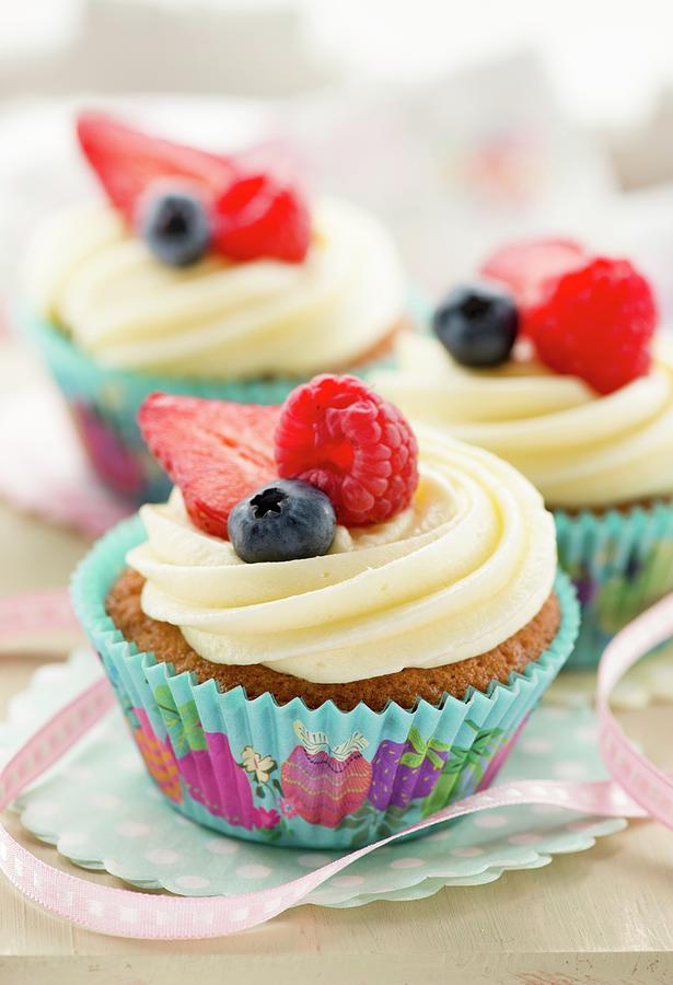 Cupcake Decorated With Buttercream And Fresh Berries Photograph by Jonathan Short