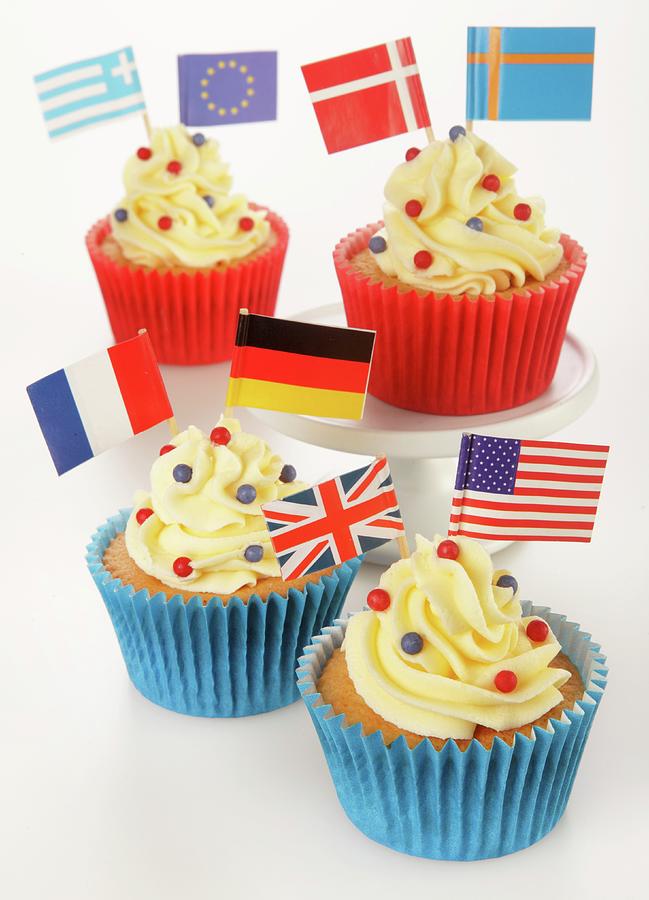 Greek Photograph - Cupcakes Decorated With Buttercream And Various Flags by Foodfolio