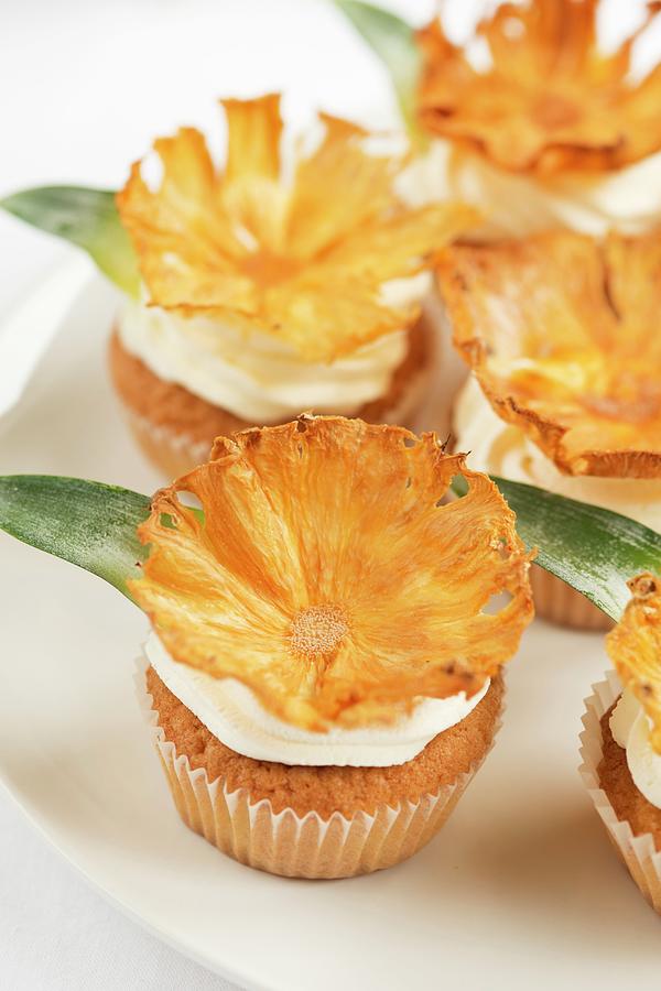 Cupcakes Decorated With Dried Pineapple Chips Photograph by Ewa Rejmer