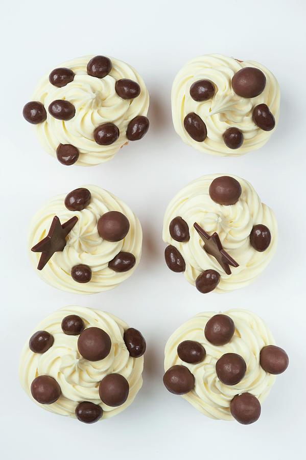 Cupcakes With Cream Icing And Chocolate Decoration Photograph by Linda Burgess