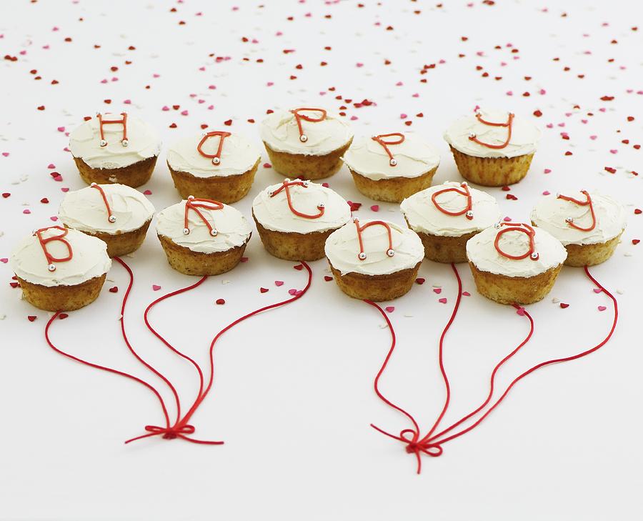 Cupcakes With White Glaze And Letters Spelling Out Happy Birthday Photograph by Corder, Neil