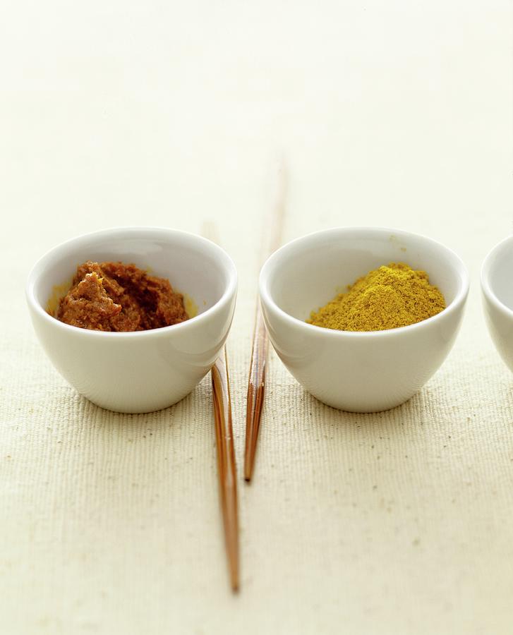 Curry Paste And Curry Powder In Small Bowls Photograph by Michael Wissing