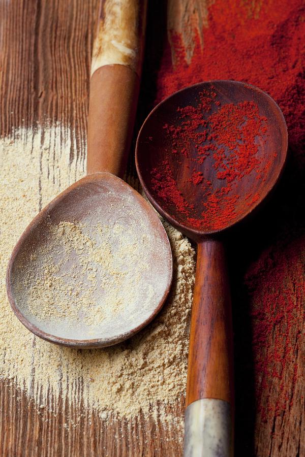 Curry Powder And Paprika Powder On Wooden Spoons Photograph by Hilde Mche