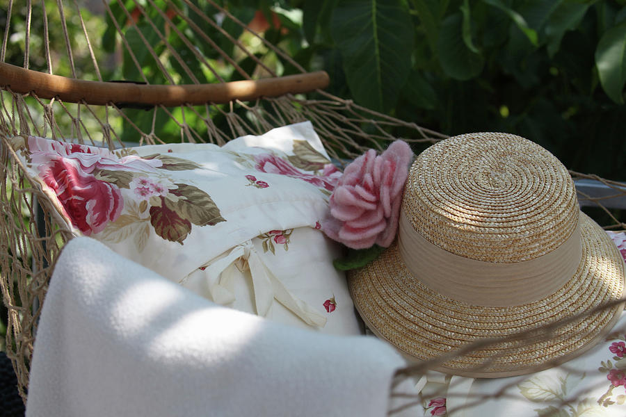 Cushions And Straw Hat On Hammock Photograph by Sonja Zelano