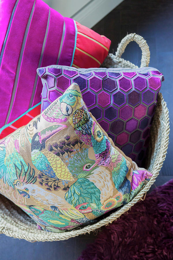 Cushions With Patterns Of Birds, Hexagons And Stripes In Basket Photograph by Anne-catherine Scoffoni