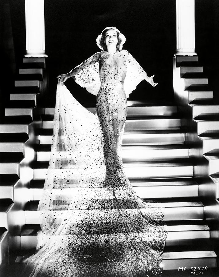 Custome by Adrian. JOAN CRAWFORD . Photograph by Album