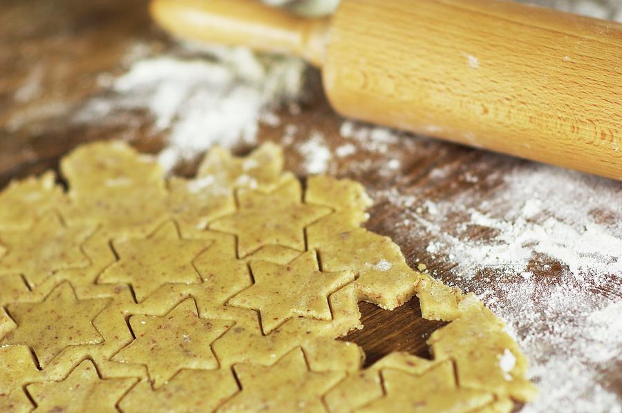 Cut-out Almond Biscuits, Flour And A Rolling Pin Photograph by Christine Gill