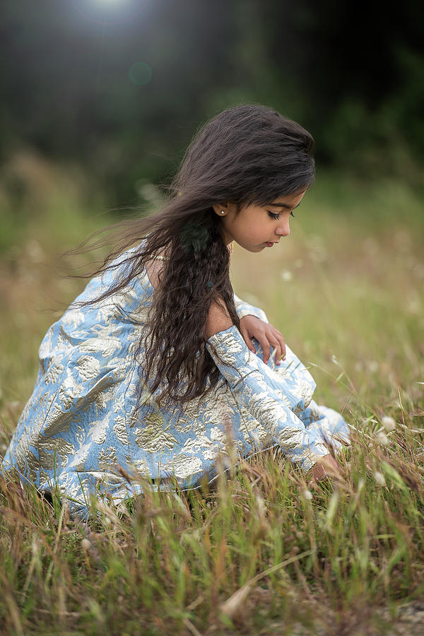 Cute Little Indian Girl Playing In Magical Field Photograph By Cavan Images Pixels